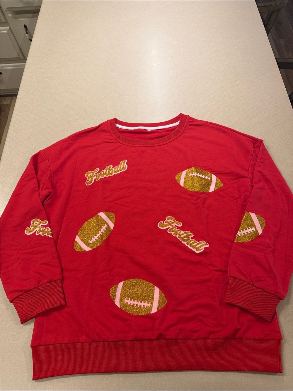 New Cozy football sweatshirt red with sparkly football accents. Fun for Sunday!!